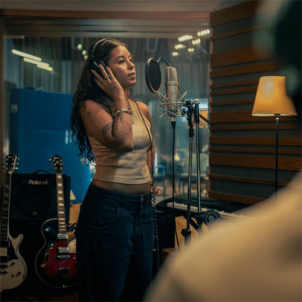 Singer recording vocals in a studio